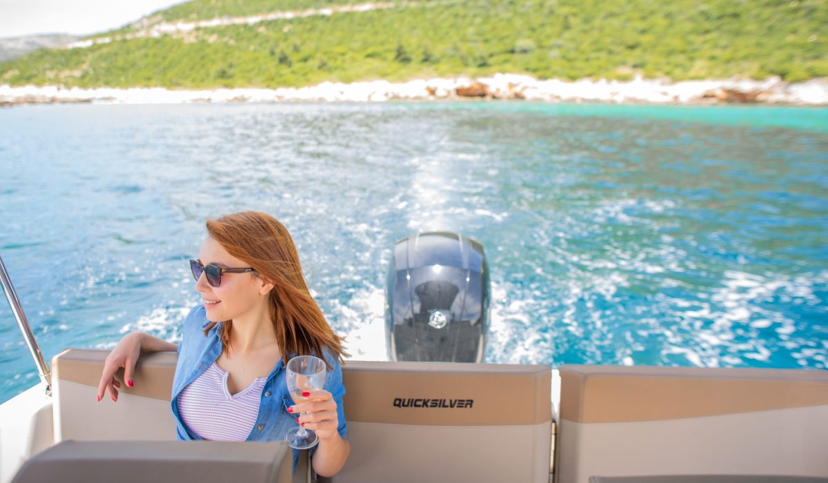 A woman enjoying on a speedboat
